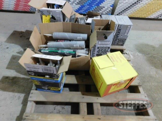 Pallet of subfloor glue- sealant- roof cement- and misc-_1.jpg